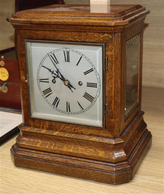 A Victorian oak mantel clock striking on gong height 34cm